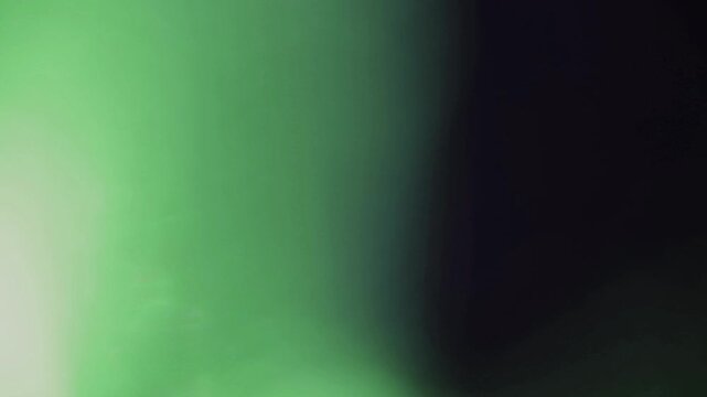 light leak and bokeh overlay with soft green hues and dark transitions, perfect for adding artistic flair or mood to your projects.