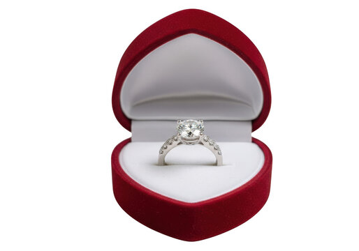 A diamond ring in a red velvet jewelry box isolated on transparent background