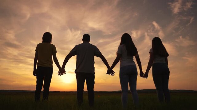 team people silhouette a holding hands. teamwork business together concept. group collective silhouette people hold together go to the goal joined hands. business lifestyle people teamwork