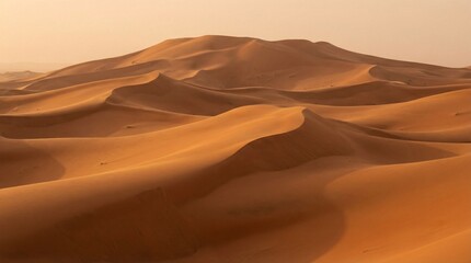 Majestic desert landscape with rolling sand dunes at sunset