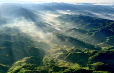 Misty Mountain Majesty: Sunbeams Pierce Through Verdant Peaks