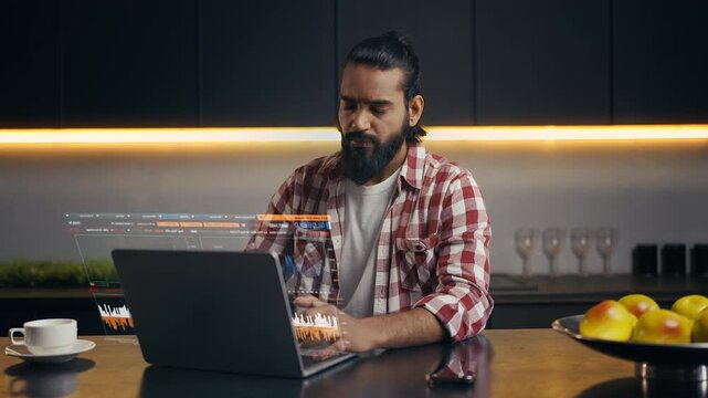 Stock market broker working on futuristic holographic screen analysing indexes