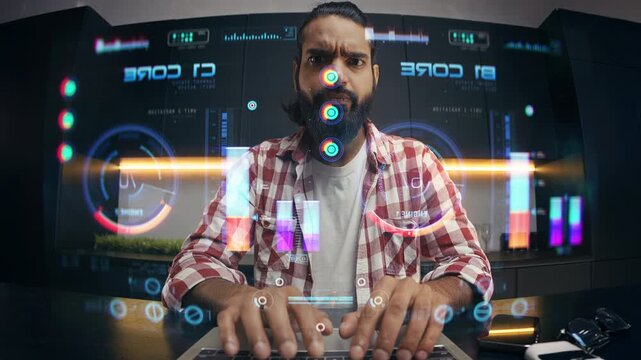 Indian male engineer attempting to launch program on futuristic computer display