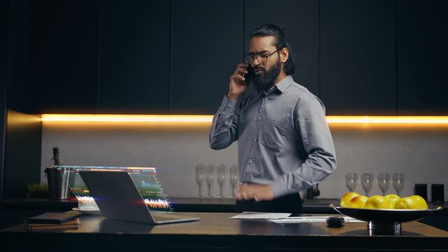 Angry boss talking on phone, checking low company profit on holographic screen
