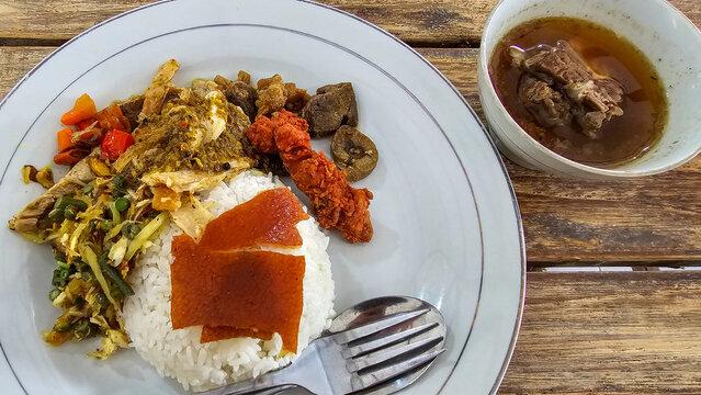 Traditional Balinese Babi Guling Suckling Pig Rice with Crispy Skin Lawar and Pork Rib Soup