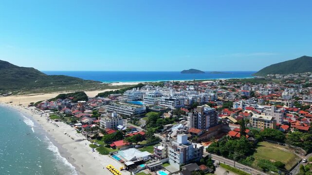 Aerial perspective of the Atlantic Ocean waterside of popular Praia Dos Ingleses and Praia do Santinho beach resort, Florianopolis, Santa Catarina, Brazil