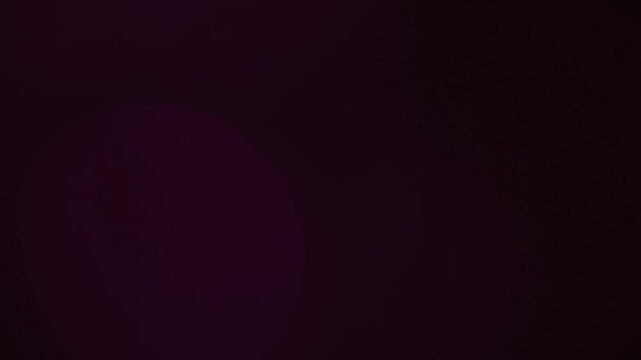 light leak and bokeh overlay with magenta and purple hues. This video can be used as a transition or visual effect.