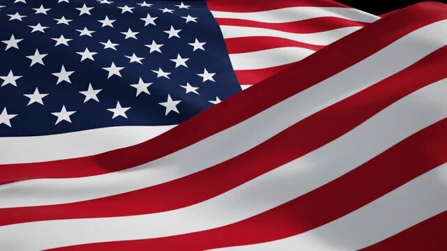 American flag waving in the wind on a clear day with bright colors and visible shapes of stars and stripes