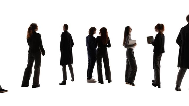 Promo video. Business professionals standing in row holding laptops and tablets isolated on white. Concept of candidate selection, team building and corporate hiring strategy.