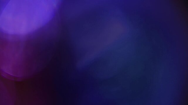 Light leak and bokeh overlay with magenta and blue hues, creating a dreamy, ethereal effect. Perfect for adding a cinematic touch to videos.