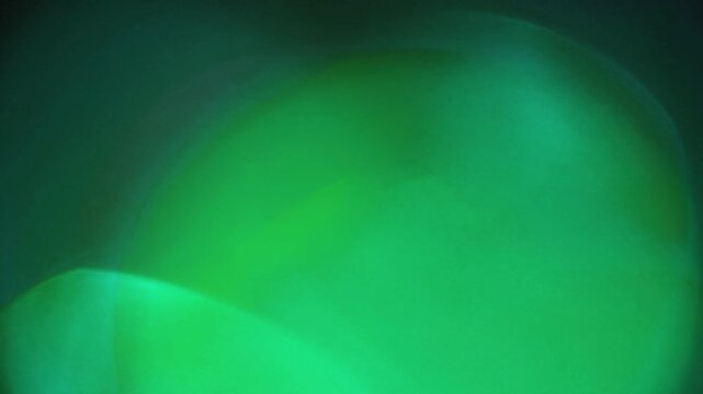 Light leak and bokeh overlay with green and blue hues, creating a dreamy, ethereal effect. Perfect for adding atmospheric depth and visual interest to your projects.