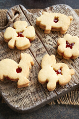 Fototapeta premium Linzer cookies in the shape of Easter animals filled with strawberry marmalade