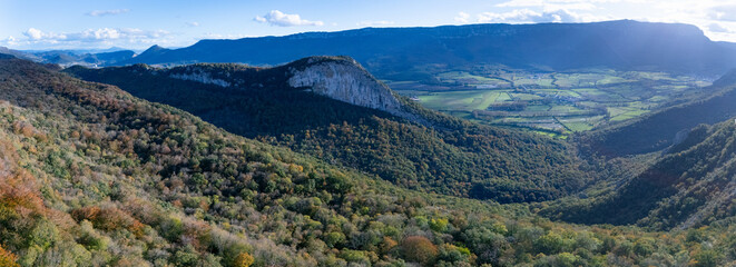 Fototapeta premium Aerial drone view of the autumn landscape surrounding the beech forest and the Sanctuary of San Miguel de Excelsis in the Sierra de Aralar. Huarte-Araquil, Navarre, Spain, Europe