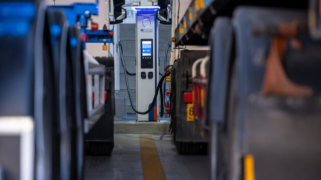 EV charging and semi truck electric vehicle, Electric vehicle semi truck trailer charging station for charge EV battery, Plug for vehicle electric engine, EV charger semi truck trailer station.