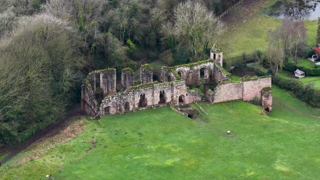Aerial drone footage of the village of Spofforth in Harrogate North Yorkshire England showing the ruins of the Spofforth Castle on a cold day in the winter time