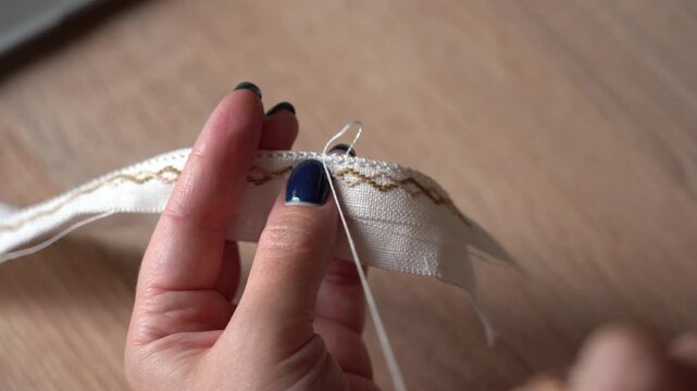Crafting a simple ribbon with lace for clothing decor. Traditional Ukrainian Embroidery