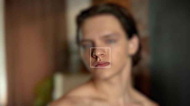 Male portrait with square frame highlighting eye while rest of face softly blurred. Concept of biometric identification, facial authentication and digital beauty diagnostics for secure platforms.