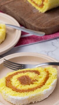 Roll cake or swiss cake filled with dulce de leche