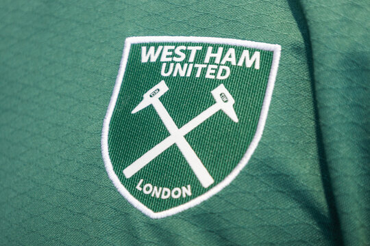 West Ham United football club logo on green shirt. London, UK, 14 July 2024