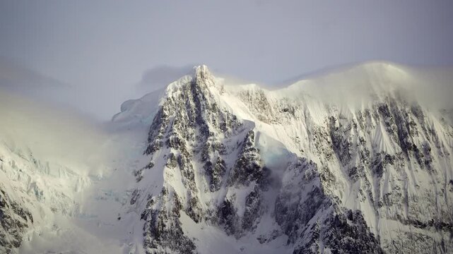 Time lapse of Cord&oacute;n Adela mountain range in Patagonia with strong winds lifting snow across the summit of Cerro Grande.
