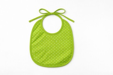 Green polka dot baby bib with bow isolated on white background