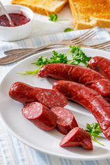 Smoked isterband sausages on a plate