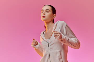 Stylish young woman enjoying a vibrant moment in a chic setting with pastel tones