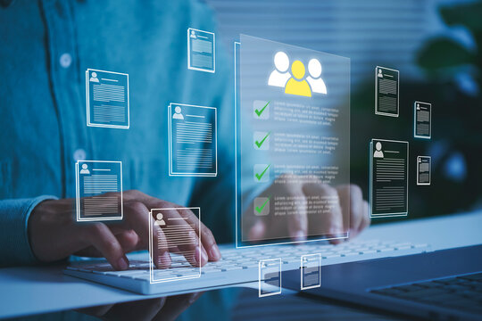 Digital recruitment platform interface with candidate profiles on virtual screen HR manager typing on laptop to streamline talent acquisition resume screening and online hiring process.