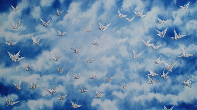 Paper Cranes Flying Over Blue Clouds