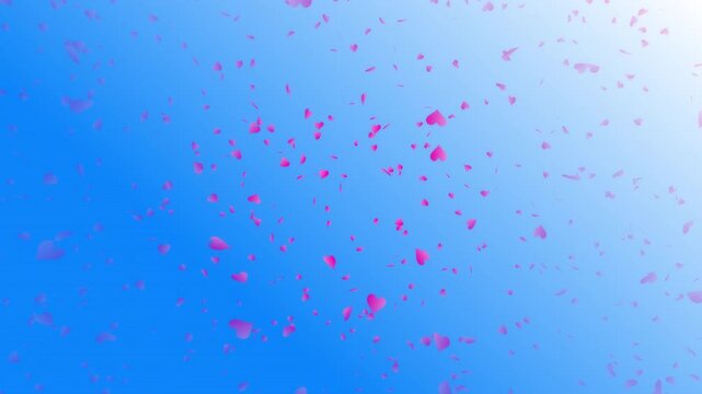 Pink heart shapes being lit up and falling down on blue gradient background. Abstract background for Happy Valentine's day and wedding ceremony.