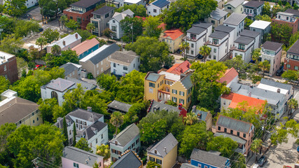 Fototapeta premium Panoramic Aerial view of stunning houses in neighborhood landscapes of coastal Charleston, South Carolina downtown skyline showcasing lowcountry metropolitan scenery