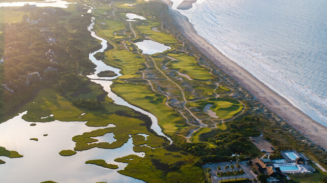 Aerial view of ocean golf course on Kiawah Island, South Carolina lowcountry landscapes with beachfront coastal views during morning sunrise