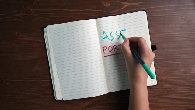 Asset portfolio and wealth management planning concept with handwritten notes in diary