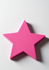 Obraz premium A simple star shape cut from thick, brightly colored pink craft foam, resting on a clean white surface, perfect for hobbies and decorations ,slab ,insulation ,thick