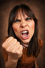 Angry Woman Shouting with Clenched Fist &ndash; Intense Emotional Close Up Portrait