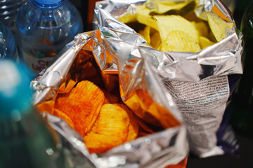 Snack bags with chips on a table at a gathering
