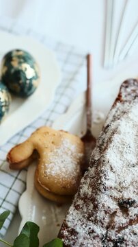 Bakery display with sweet bread and decorated eggs on a festive table setting