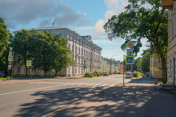 Naklejka premium International street and the surrounding cityscape on a sunny summer day, Kronstadt, Saint Petersburg, Russia