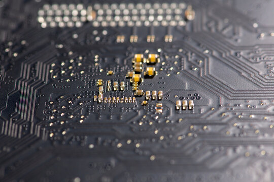 Circuit board with integrated electronics. Circuit board in hardware background. Circuit board for computing data. Circuit board as abstract texture.