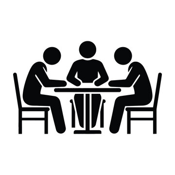 Three people sitting at a table in meeting