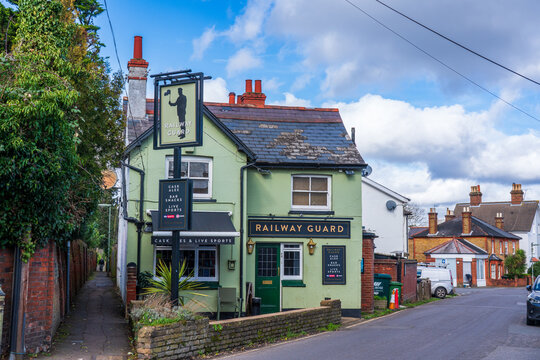 Exterior street view of Railway Guard traditional British pub in Epsom, UK,  on sunny day