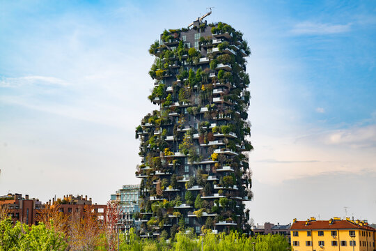 Vertical forest building. Bosco Verticale skyscraper in Milan. Sustainable architecture. Vertical forest tower in Italy. Modern apartments by greenery.