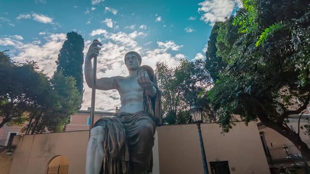 Majestic colossal statue of Roman emperor Constantine The Great, located in the courtyard of the Capitoline Museums in Rome, under a beautiful cloudy sky on a sunny day in the eternal city