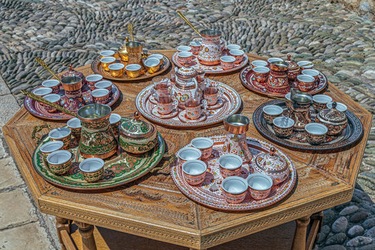Tea and coffee drinking sets, with specific traditional decorations from Bosnia and Herzegovina, located on a narrow street in the Old bridge area of the old city of Mostar.