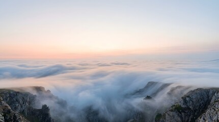 Fototapeta premium Sea of Clouds Over Majestic Mountain Peaks at Sunrise
