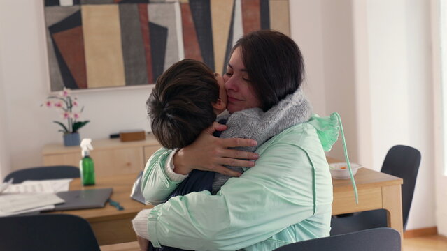 Mother hugging child tightly with eyes closed, conveying deep emotional warmth, love, and protective nurturing bond, strong sense of connection and family intimacy