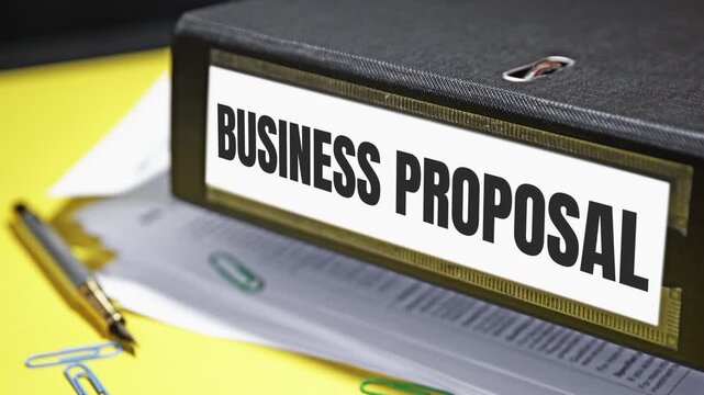 Close-up video of business proposal binder on yellow background with clips and pen in office