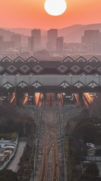 Sunset at Suzhou Railway Station: High-Speed Train Arrival and Departure Time Lapse