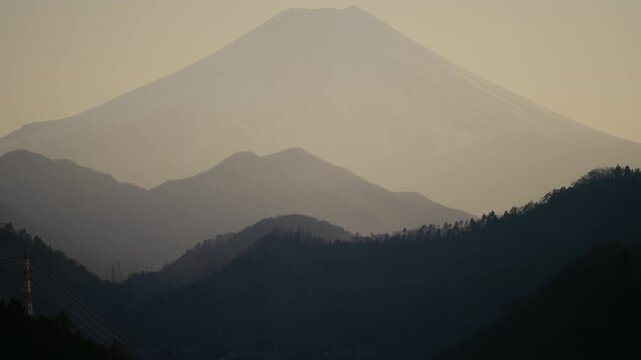Picturesque Japanese cityscape with Mount Fuji rising behind Otsuki.