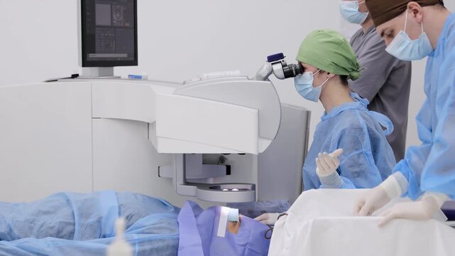 Ophthalmologist performing eye surgery using high-tech medical laser equipment for vision correction procedure